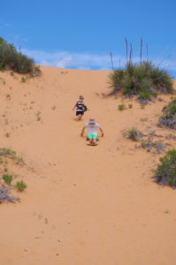 Sledding at Coral Pink Sand Dunes